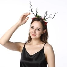 Detail of floral deer antler headband with red berries and pink flowers for hair styling