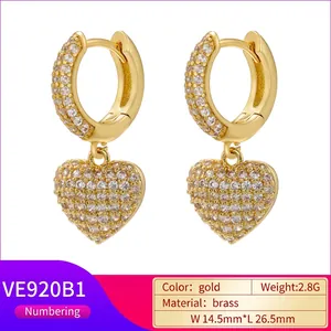 Luxurious gold heart hoop earrings with pavé crystals in polished brass for women