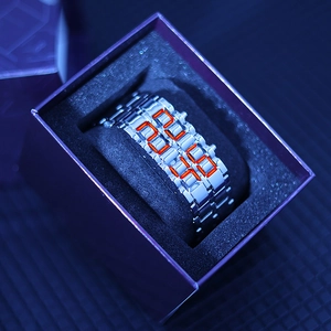 Silver LED digital watch with red numbers displayed in a purple gift box for men