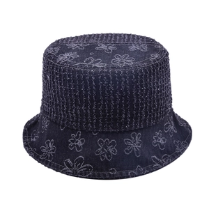 Deep blue denim bucket hat with white floral pattern and textured stitching details