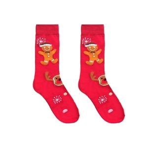 Detail of red Christmas crew socks featuring gingerbread man and reindeer holiday patterns