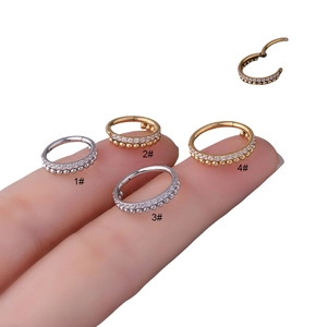 Surgical steel clicker ring with zircons and metal beads for nose or ear piercings