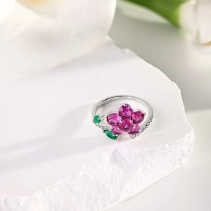 Macro shot of S925 silver flower ring with rose red and green zircon gemstones
