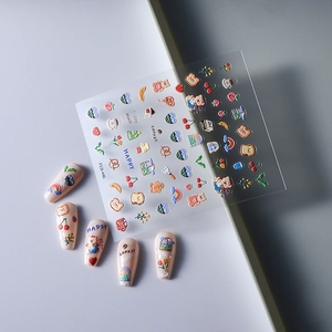 Close-up of 5D embossed nail stickers featuring cute bears and floral patterns