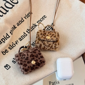 Faux fur leopard print mini bag charms with gold metal hooks and luxury plush texture