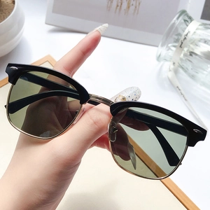 Classic retro semi-rimless sunglasses with black gold frame and dark green lenses