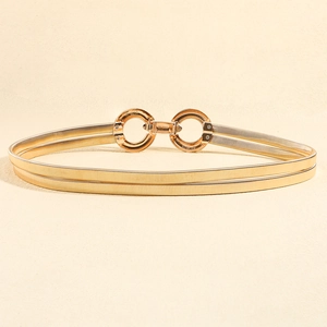 Detail of gold elastic spring waist chain with double geometric interlocking rings