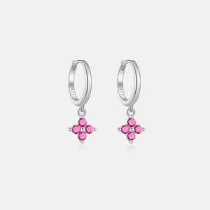 Detail of S925 sterling silver hoop earrings with pink flower-shaped gem pendants
