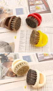 Detail of beard grooming ring brush with firm bristles and ergonomic finger loop handle