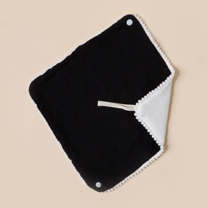 Cotton baby bandana bib with pompom trim and dual-layer black and white muslin fabric