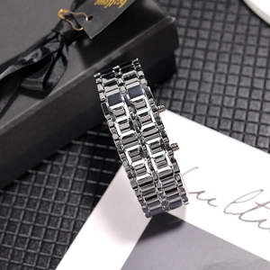 Detailed macro view of the silver stainless steel link strap with side adjustment buttons