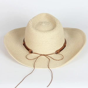 Classic straw cowboy hat in cream beige with a brown ribbon band for sun protection