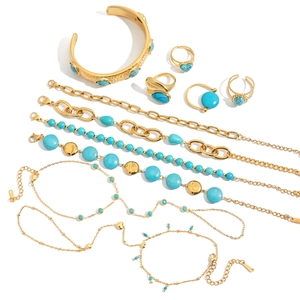 Bohemian gold stainless steel jewelry set featuring turquoise beads and heart rings