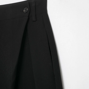 Women's black casual pants with asymmetric waist and double-button closure detail