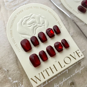 Handmade wine red cat-eye press-on nails with ruby-like gems and 3D crystal accents
