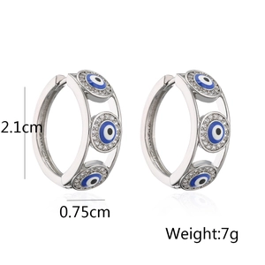 Detail view of evil eye hoop earrings with size 2.1cm by 0.75cm and weight 7g labels