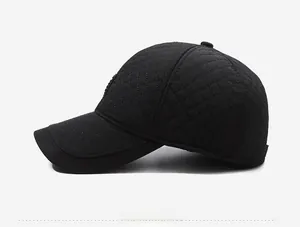 Side view of men's winter baseball cap showing black quilted diamond pattern texture