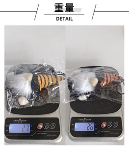Weight display of Halloween gnome plush toy on an electronic scale showing 26g and 27g
