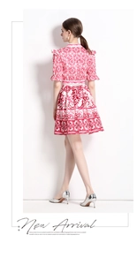 Detail of red and white floral vintage dress with ruffle sleeves and high-waisted cut