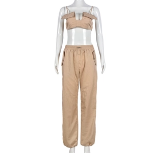 Detail of khaki two-piece set featuring cropped camisole top and drawstring joggers