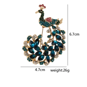 Detailed view of peacock brooch dimensions 6.7cm by 4.7cm with weight of 26g