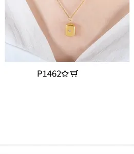 Close-up of model wearing gold rectangle sun moon pendant necklace with zircon detail