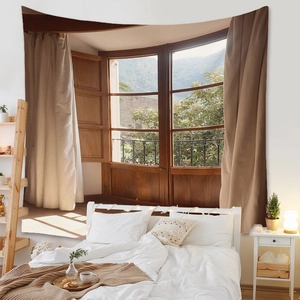 Detail of bohemian wall tapestry featuring a vintage window view of mountains in a bedroom