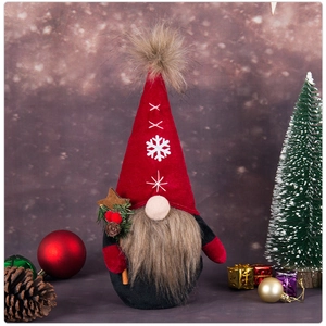 Detail of Christmas gnome with snowflake hat holding pine needles and pinecone