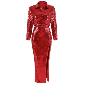 Detail of red sequin shirt and high slit skirt showing high-density sequin texture