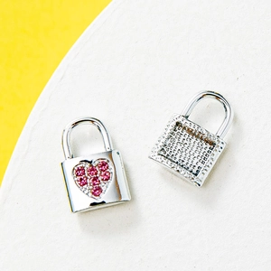Colorful rhinestone padlock charms for necklaces or bracelets on a dual-tone stand