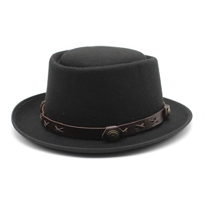 Close-up of black wool felt hat featuring brown leather band with antique metal studs