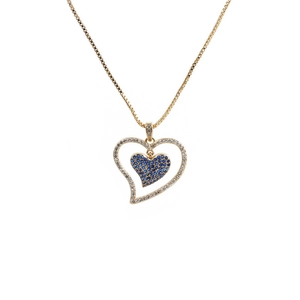 Detailed view of heart pendant with blue stones and golden box chain on white background
