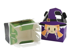 Detailed view of Halloween candy paper boxes featuring cute witch and green polka dot design