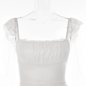 Detail of white mini dress featuring lace off-shoulder sleeves and ruched bodice design