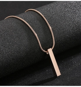 Detailed view of rose gold 3D rectangular pillar pendant on a sleek snake chain necklace