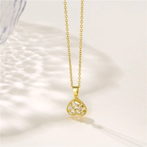 Golden heart pendant necklace with clear zircon stones on a refined stainless steel chain