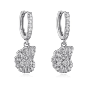 Close-up of silver conch shell drop earrings with sparkling cubic zirconia pavé setting