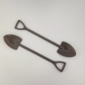 Detail of dark brown mini plastic shovel decoration for DIY Christmas tree crafts