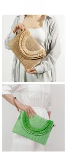 Detail of straw woven clutch bags with layered fringe tassels and brown leather wrist straps
