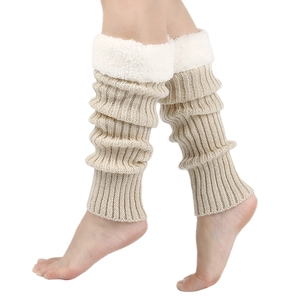 Close-up of beige knitted leg warmer featuring soft white faux fur trim on the top edge