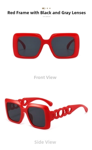 Detail view of red square oversized sunglasses featuring unique hollow chain temple design