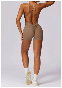 Detail of cross back straps and scrunch butt design on taupe yoga bodysuit