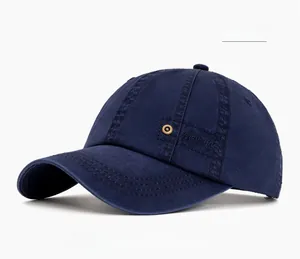 Close-up of navy blue cotton baseball cap with vintage metal rivet and side embroidery