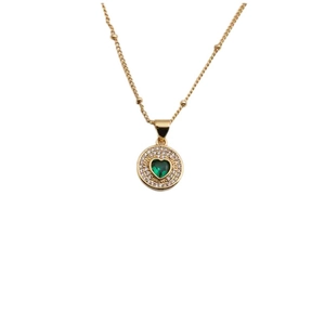 Gold chain necklace with a round green heart stone pendant and crystal halo on white background