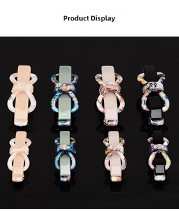 Detail of stone-textured bow hair clips with rhinestones in various colors and sizes