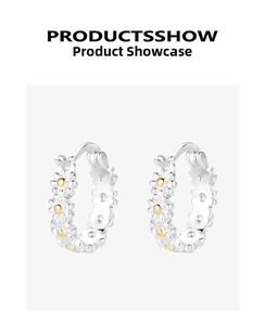 Detailed macro view of S925 silver daisy hoop earrings with golden floral centers