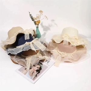 Summer wide brim straw sun hats with lace bows and mesh edges in various colors