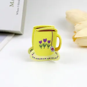 Close-up of yellow coffee cup hair claw with purple tulip flower designs, size 5x4x4cm