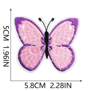 Detail showing pink and purple butterfly embroidery patch with clear stitching and dimensions