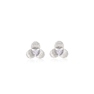 Macro detail of petal earrings with silver textured finish and purple zircon stones
